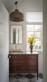 Another bright and airy powder room, flooded with natural light.