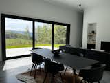 Main living space with expansive views of the Taconic Mountain range in the distance and sheep meadows below