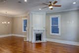 Living Room, Medium Hardwood Floor, Ceiling Lighting, Two-Sided Fireplace, Recessed Lighting, and Standard Layout Fireplace  Photo 4 of 30 in 1900 Victorian Home in Historic Savannah GA by Historic Savannah Homes By Liza DiMarco