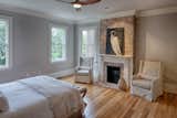 Bedroom, Light Hardwood Floor, Recessed Lighting, and Ceiling Lighting  Photo 13 of 39 in Newly Renovated Historic Home in Savannah GA by Historic Savannah Homes By Liza DiMarco