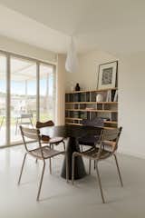 Dining Room, Concrete Floor, Ceiling Lighting, Storage, Shelves, Table, Lamps, and Chair  Photo 13 of 14 in BON by Aurélien Aumond