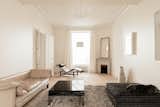 Ceiling Lighting, Light Hardwood Floor, Chair, Coffee Tables, and Sofa  Photo 5 of 17 in MET by Aurélien Aumond