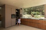 Kitchen, Refrigerator, Wood Cabinet, Concrete Floor, Ceiling Lighting, and Wall Oven  Photo 9 of 22 in RGV House by Aurélien Aumond