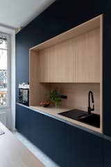 Kitchen, Wall Oven, Refrigerator, Travertine Floor, Wood Counter, and Laminate Cabinet  Photo 5 of 11 in Saint Nizier by Aurélien Aumond