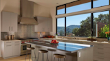 Open plan kitchen features large island and picture window with views of Mt. Tam.