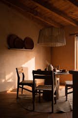 The materiality and tiny spaces evoke silence and introspection