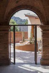 The new hospitality spaces are respectfully integrated into the existing buildings and environment.