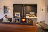 Built-in cedar seating area provides a 'room within a room' for family to gather around the fire