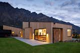 Single-pitched roof forms embrace the mountain backdrop