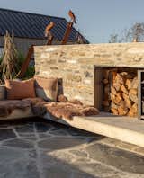 Stone and concrete outdoor sunken wood fire