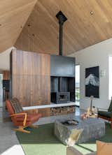 Feature wood fire separates living and dining spaces