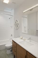 Childrens Bathroom with Skylight, Green Floor Tile and MCM Vanity