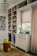 A sizable, custom Walk-In Closet was an essential requirement for the fashion-forward owner of this residence. The Dressing Area is adorned with the same pastel linen as the adjoining Bedroom.