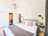 Master bedroom with ensuite bathroom overlooks the woodsy area behind the property.