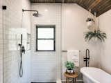 The en suite Master Bath features a soaking bathtub, perfect for filling with bubbles or salts to kick back and relax.