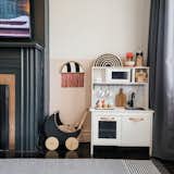 IKEA play kitchen, with its own DIY renovation to fit the aesthetic of the space & house.