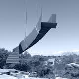 The steel stair structure, which curls and twirls was craned into position with precision. 
