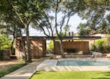 Outdoor, Concrete Fences, Wall, Swimming Pools, Tubs, Shower, Wood Patio, Porch, Deck, Landscape Lighting, Concrete Pools, Tubs, Shower, Back Yard, Large Patio, Porch, Deck, Decking Patio, Porch, Deck, and Trees Pool + Pavilion  Photo 1 of 6 in Austin Pool Pavilion by Hunt Architecture