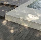 Outdoor, Decking Patio, Porch, Deck, Wood Patio, Porch, Deck, Concrete Pools, Tubs, Shower, Back Yard, Walkways, and Swimming Pools, Tubs, Shower Pool detail   Photo 5 of 6 in Austin Pool Pavilion by Hunt Architecture