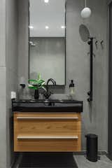 Bath Room, Stone Counter, Wood Counter, Tile Counter, One Piece Toilet, Ceiling Lighting, Ceramic Tile Floor, Whirlpool Tub, Stone Tile Wall, and Drop In Sink  Photo 11 of 11 in 11 LINE by OMNIA STUDIO