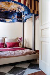 The four-poster bed was also customized by Piermattei.