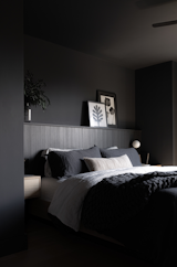 The primary bedroom features a low bed and lighting by Montreal brand Luminaire Authentik