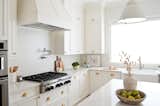 All-white kitchen with ample storage