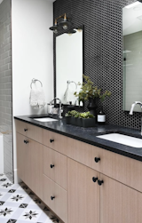 Bathroom with unique tiling on the floor and backsplash