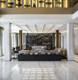 LIVING ROOM - Flooring in Bianco Lasa marble by Antolini; lighting by iGuzzini; windows by MQ; window drapery by Rubelli; coffered ceiling: custom designed by ORA Studio NYC; sofa by Fendi.