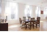 Before: The dining area received less light due to the original walls that blocked the windows in the back of the loft.  Photo 11 of 21 in Before & After: A Light-Catching Glass Box Brightens Up a Tribeca Loft