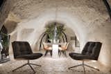 Dining, Chair, Table, Floor, Accent, and Terrazzo  Dining Chair Floor Terrazzo Photos from A Primal Space Gets a Swanky, Modern Twist in This Turkish Cave Loft