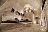 Living Room, Bench, Terrazzo Floor, Floor Lighting, and Ceiling Lighting  Photos from A Primal Space Gets a Swanky, Modern Twist in This Turkish Cave Loft