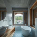Bath Room, Vessel Sink, Freestanding Tub, Ceramic Tile Floor, and Porcelain Tile Wall  Photos from Romantic Ruins Enclose a Modern House in the Czech Republic