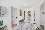 White entryway is bright and welcoming