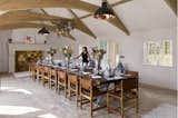 Dining room of Walled Garden featuring the Spun Reflector pendant from Davey Lighting/Original BTC