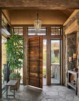 Stonework seamlessly blends indoor and outdoor spaces as seen here in the welcoming entryway.