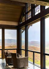 Floor-to-ceiling windows allow the homeowners to enjoy views of Emerald Mountain and the valley below.