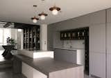 Kitchen with bespoke wine, spices and tea display shelves