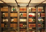 Bespoke library shelves with feature ceiling