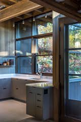 Kitchen, Engineered Quartz, Concrete, Stone Slab, Ceiling, Metal, Drop In, and Concrete  Kitchen Metal Engineered Quartz Photos from Kayak Point