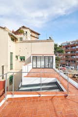 Outdoor and Rooftop  Photo 16 of 17 in Picture Windows and Sliding Doors Work Magic in This Cozy Barcelona Home