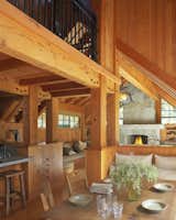 Dining, Medium Hardwood, Table, Chair, Bench, and Standard Layout  Dining Standard Layout Bench Chair Photos from A Rustic Home Rivals the Rugged Beauty of Its Forest Setting