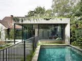 A Concrete and Glass Pavilion Opens This 1930s Home to a Tiered Garden