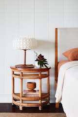 The nightstand is vintage, and the lamp is part of the 96 Molecules collection by Aqua Creations. 