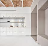 A Renovated Barcelona Flat Glows With All-White Interiors and Restored Brick Ceilings - Photo 2 of 10 - 