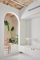 Hallway and Concrete Floor  Photo 3 of 10 in A Renovated Barcelona Flat Glows With All-White Interiors and Restored Brick Ceilings from AllAround Lab Barcelona