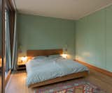 Bedroom, Lamps, Bed, Night Stands, Medium Hardwood Floor, and Rug Floor  Photos from Haus am See