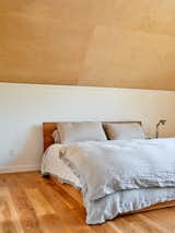 "I've always liked a Japanese style tatami platform bed. It has a super simple backboard and frame and I like how it sits low to the ground. We also wanted to have a king size. We felt really lucky to find one for a great price on Etsy."