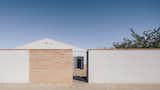 The exterior wall is the minimum height required by local regulations.