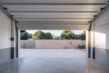 Garage of Casa Ja! by Bizna Estudio